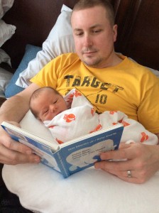 Daddy and Cameron reading a book.